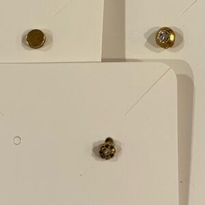 3 pierced studs.  Gold/faux diamonds.  NEW